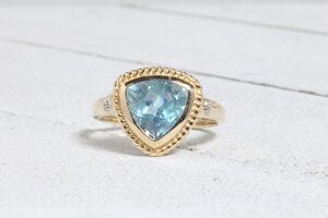  10k Yellow Gold Blue Topaz Trillion with Rope Detailing Ring