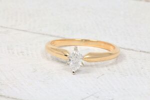  14k Yellow Gold. 1/4cttw Marquise Cut Tiffany Solitaire Engagement Ring